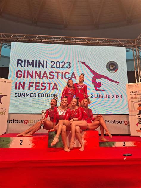 podio di ginnastica artistica con atleti dell'Alma Juventus Fano